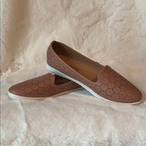 Mauve slip on shoes.